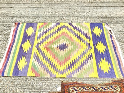 Lot 1411 - Kilim rug with geometric decoration on blue, yellow, green and red ground, 157cm x 90cm, together with two small eastern rugs (3)