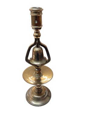 Lot 723 - H.M.S. Britannia, Dartmouth 1869 - 1905, brass tavern candlestick, drilled for electricity, 34cm in overall height.