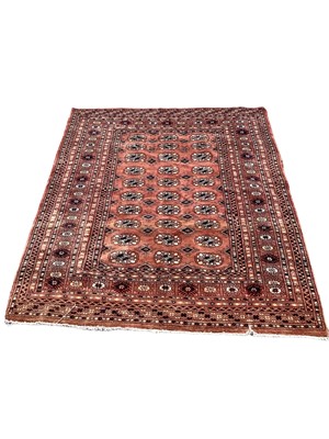 Lot 1423 - Eastern rug with 30 central medallions on red ground, 157cm x 126cm