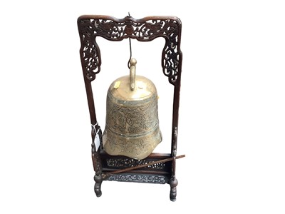 Lot 2495 - Antique Chinese brass bell in a wooden stand