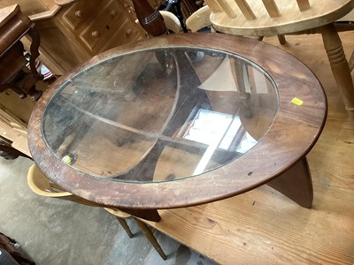 Lot 1435 - Mid century teak oval Astro table, 122cm x 66cm (frame damaged) together with a vintage television in teak case (2)