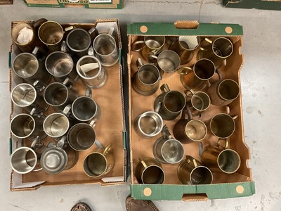 Lot 428 - Two boxes of military related pewter and brass tankards.