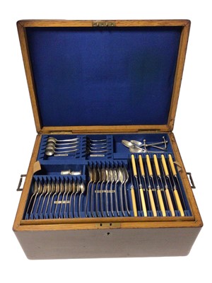 Lot 447 - Early 20th century oak canteen of Old English pattern cutlery.