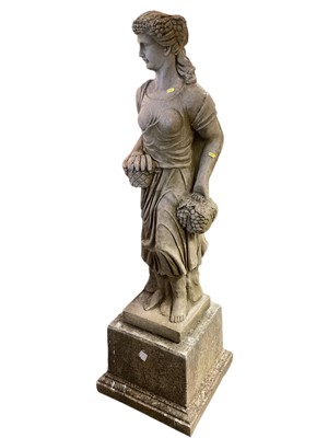 Lot 1462 - Concrete garden statue of a lady carrying fruit on plinth base, 154cm high