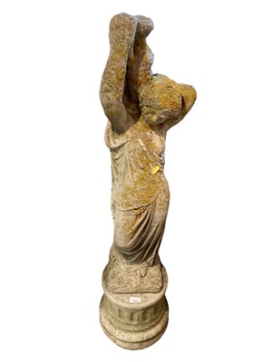 Lot 1464 - Concrete garden statue of a female water carrier on plinth base, 120cm high