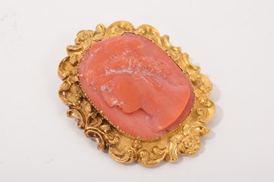 Lot 577 - Two 19th century carved coral and yellow metal mounted brooches