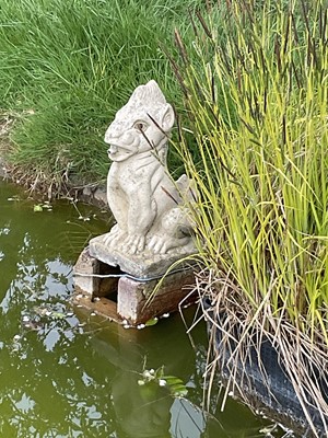 Lot 1474 - Pair of weathered concrete garden pond fountains in the form of gargoyles