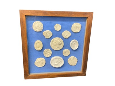 Lot 623 - Small collection of plaster intaglios, glazed frame 17 x 17cm