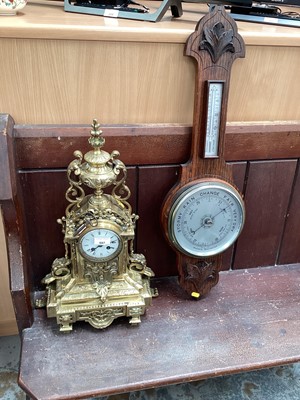 Lot 597 - Victorian style mantel clock in ornate cast brass case together with a 1930s barometer and thermometer in carved oak case (2)