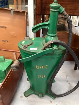 Lot 596 - Automobilia including a vintage agricultural oil dispenser, modern jerrycan in the form of traffic lights, vintage brown leather travelling trunk containing motoring USA car number plates, vintage...