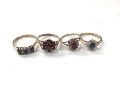 Lot 1115 - Four 9ct gold gem set dress rings