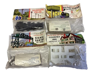 Lot 1840 - Airfix OO Gauge Red Stripe model kit packets including Signal Gantry, Country Inn, Water Tower & Telegraph Poles, plus other construction Kits, on card (1 box)