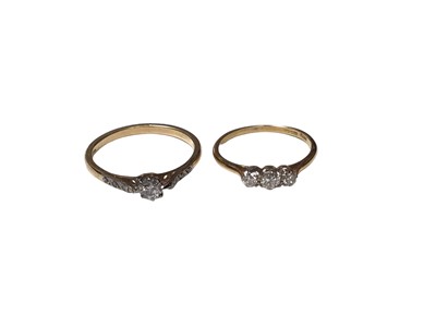 Lot 121 - 18ct gold and platinum diamond single stone ring with diamond set shoulders and an 18ct gold diamond three stone ring (2)