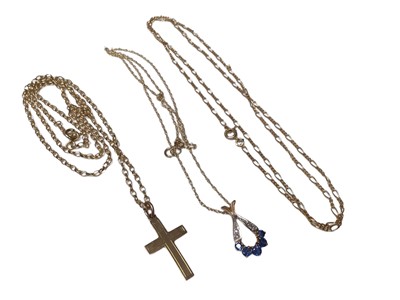 Lot 122 - Three 9ct gold chains, 9ct gold cross pendant and 9ct gold blue stone and diamond set pendant