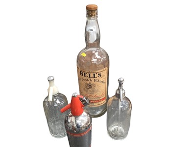 Lot 2492 - Very large Bell's whisky bottle, and three vintage soda streams