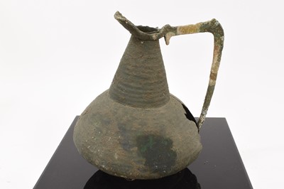 Lot 794 - Ancient, probably Roman bronze pitcher, presented in perspex box