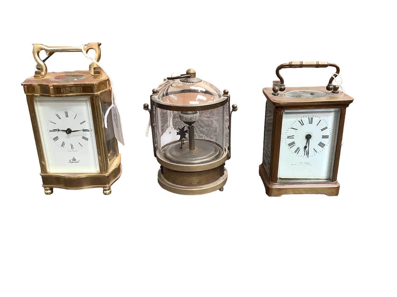 Lot 2501 - Two brass cased carriage clocks and a novelty clock with mechanical fish (3)