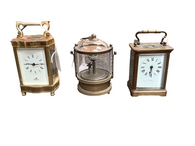 Lot 2501 - Two brass cased carriage clocks and a novelty clock with mechanical fish (3)