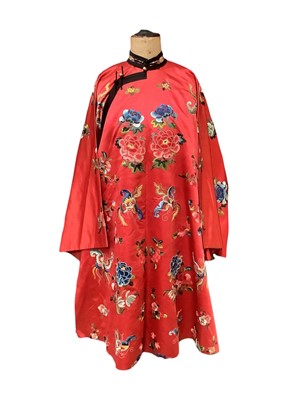 Lot 2122 - Chinese red silk robe with embroidered  robe with Forbidden knot flowers and satin stitch butterflies and flowers.  Green brocade lining..