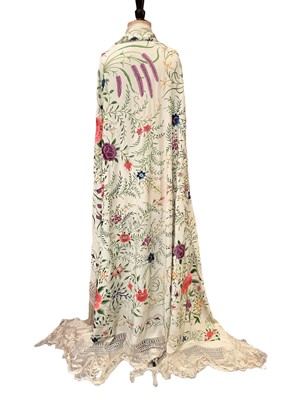 Lot 2124 - Large Chinese cream  silk shawl  polychrome embroidered flowers with long fringing.