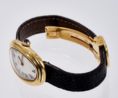 Lot 601 - Ladies Cartier 18ct gold 'Baignoire' wristwatch on black leather strap