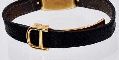 Lot 601 - Ladies Cartier 18ct gold 'Baignoire' wristwatch on black leather strap