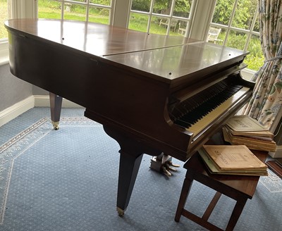 Lot 1144 - Mahogany cased baby grand piano by Hamilton, 140cm wide x 155cm deep