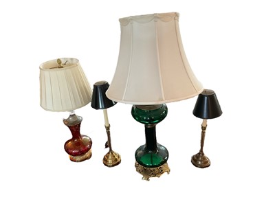 Lot 1167 - Green glass oil lamp style table lamp and shade, total height 91cm, together with three others