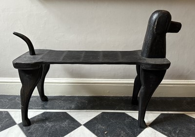 Lot 1173 - Novelty hall bench in the form of a dog with ebonised finish, 100cm long