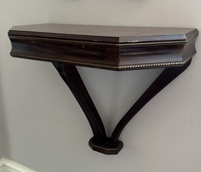 Lot 1176 - Mahogany pier table of canted outline, 61cm wide