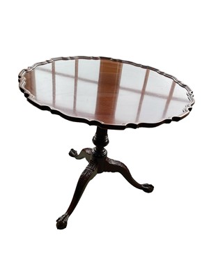 Lot 1178 - Chippendale style mahogany supper table with pie crust galleried tilt top, birdcage action, and fluted column on carved cabriole legs and claw and ball feet, by Charleston Reproductions, 75cm diame...