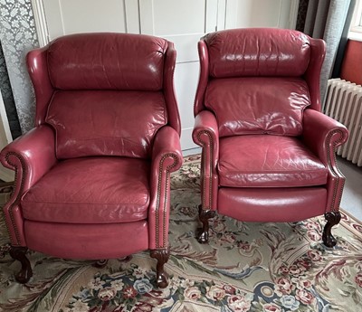 Lot 1195 - Pair of Georgian style plum coloured leather wing back recliner armchairs