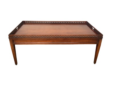 Lot 1274 - Georgian-style cherrywood coffee table of rectangular form with pierced gallery, on taper legs