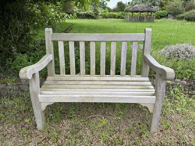 Lot 1228 - Pair of twin seater teak garden benches, 120cm wide