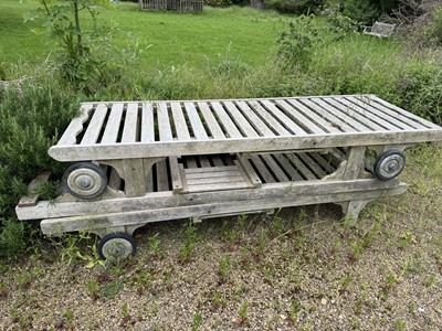 Lot 1229 - Set of four teak steamer type loungers, 195cm long