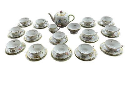 Lot 330 - Herend Queen Victoria pattern teaset, for fourteen place settings, comprising large bullet shaped teapot, milk jug, sugar bowl, fourteen cups saucers and side plates, printed marks. (46)