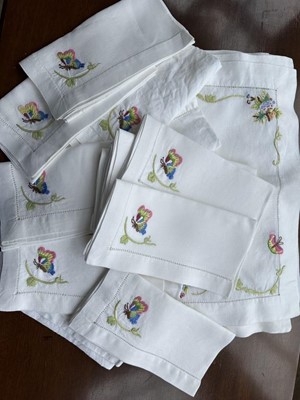 Lot 346 - Set of sixteen Herend embroided linen table mats and matching napkins with butterfly and foliate borders (32)