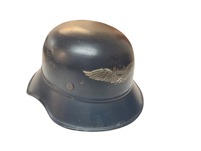 Lot 755 - Second World War Nazi Luftschutz helmet with original paint, transfer badge and liner.