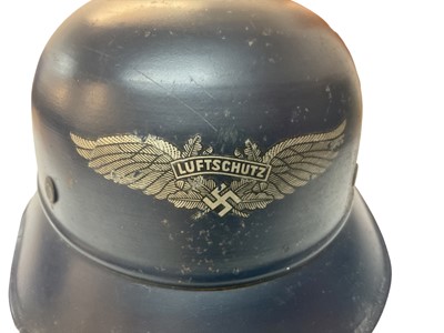 Lot 755 - Second World War Nazi Luftschutz helmet with original paint, transfer badge and liner.