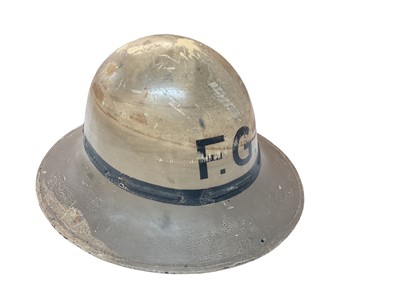 Lot 759 - Second World War British Zuckerman civil defence helmet with painted finish and F.G. initials to front, the interior with leather headband.