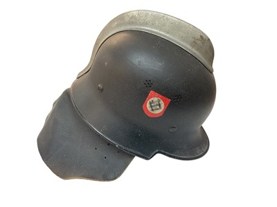 Lot 760 - Nazi M34 pattern Fire Police helmet with original aluminium comb, black painted finish with two decals (de-nazified), leather liner, chinstrap and neck cover.