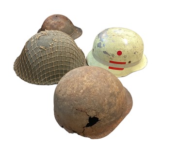 Lot 761 - Second World War Bulgarian army steel helmet, together with a replica Nazi M35 helmet on mannequin head, American helmet liner, two British MK3 pattern steel helmets and others (7 helmets).