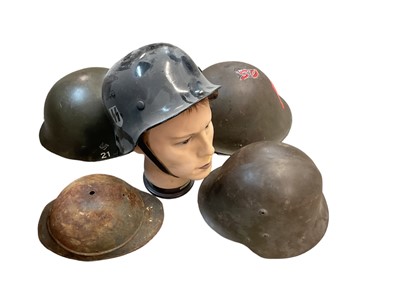 Lot 761 - Second World War Bulgarian army steel helmet, together with a replica Nazi M35 helmet on mannequin head, American helmet liner, two British MK3 pattern steel helmets and others (7 helmets).