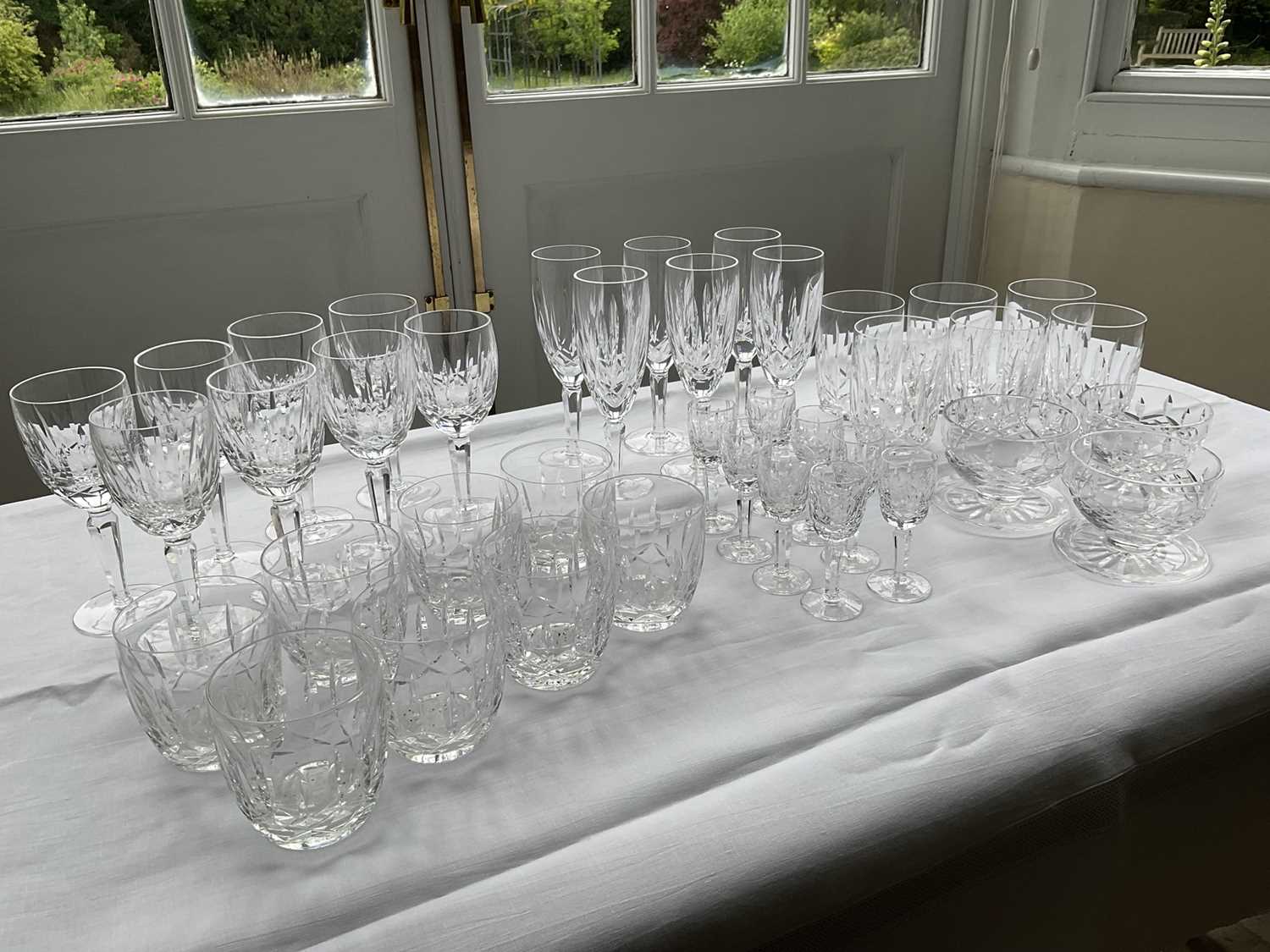 Lot 321 - Set of Waterford crystal 'Kildare' pattern glassware, comprising six champagne flutes, eight wine glasses, eight sherry glasses, eight tumblers, eight double old-fashioned glasses, three dessert bo...