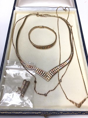 Lot 235 - Three-colour 9ct gold necklace, bracelet and earrings, 9ct chevron necklace and a 9ct gold necklace set with three small diamonds