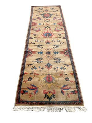 Lot 1214 - Chinese woollen runner, with meandering lotus design on bronze ground, 285 x 86cm