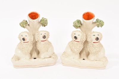 Lot 256 - Pair of Staffordshire pottery poodle spill vases