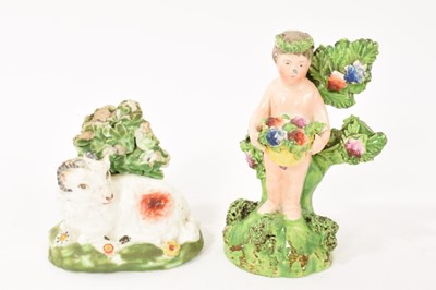 Lot 4 - Pearlware recumbent sheep, circa 1820, and a figure of a putto