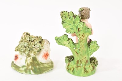 Lot 4 - Pearlware recumbent sheep, circa 1820, and a figure of a putto