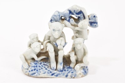 Lot 281 - Japanese porcelain group of monkeys